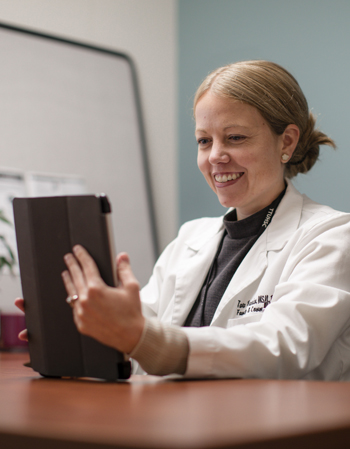 female doctor in white coat on a telehealth appointment