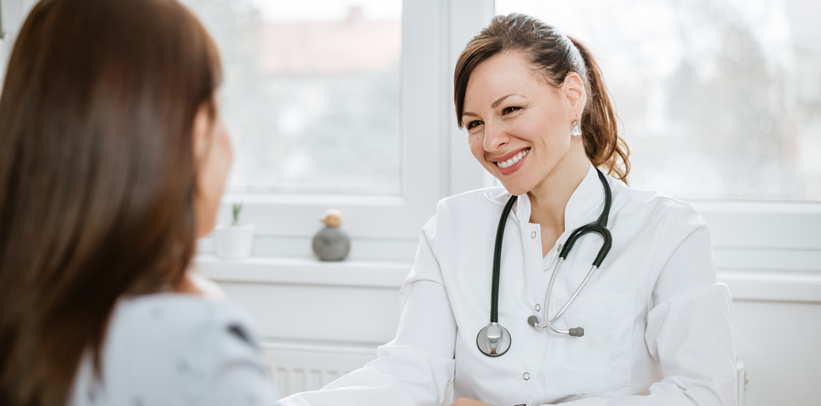 woman visiting with doctor