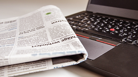 laptop and newspaper