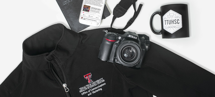 TTUHSC Branding image with camera, phone, mug and jacket with logo.  