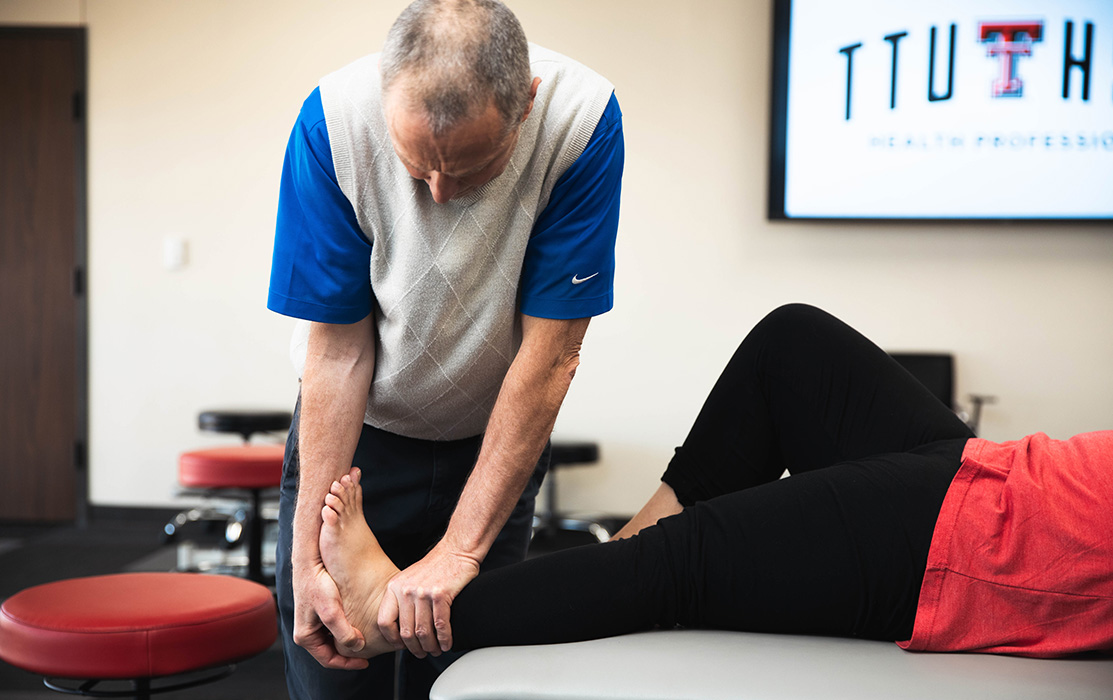 An Sc.D. Faculty demonstrates a manual manipulation on someone's foot and ankle.