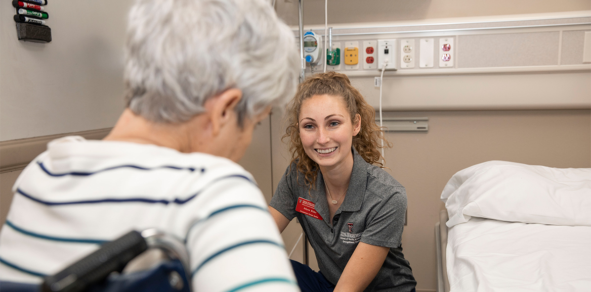 TTUHSC Occupational Therapy student talking to patient