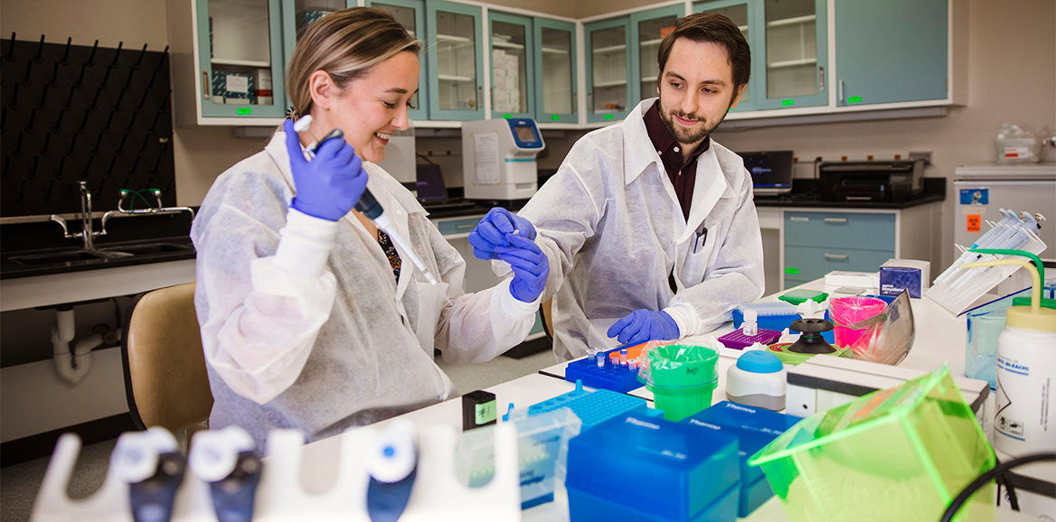 Two TTUHSC molecular pathology students perform a lab task