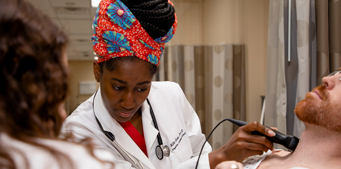 Physician Assistant student examining a patient's neck