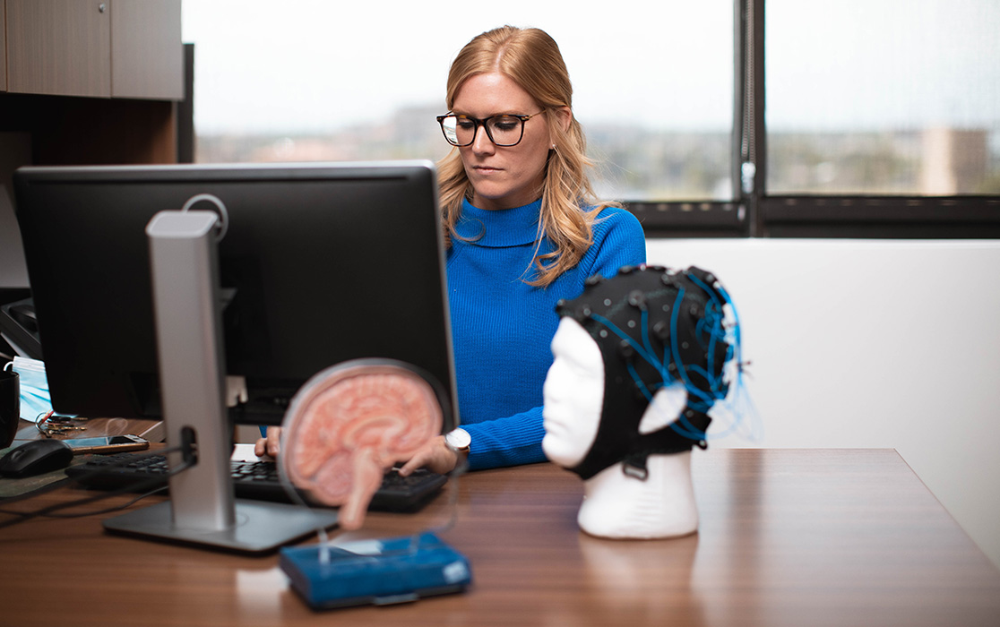 A Ph.D Student working at a computer.