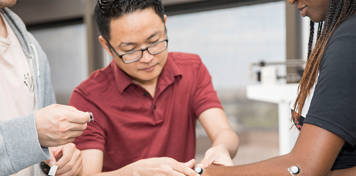 PhD RS Students perform some experiments on another student