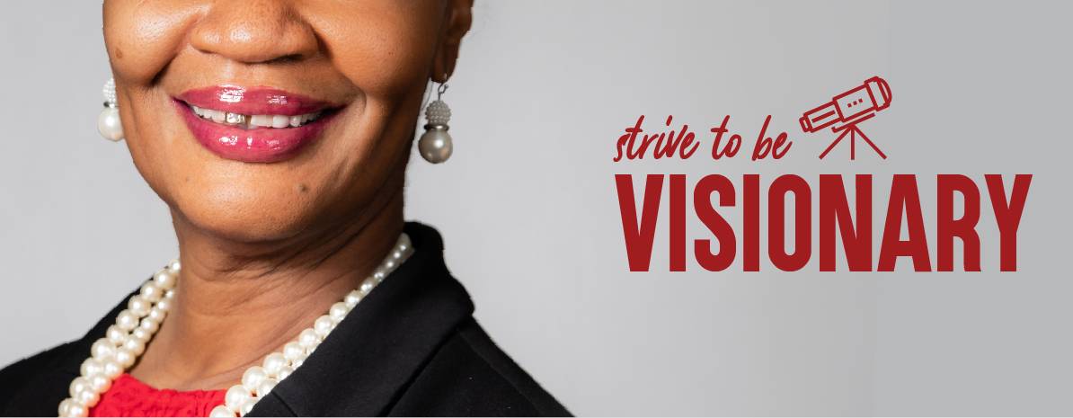 Photo of Smiling Team Member with the caption Strive to Be Visionary