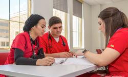 TTUHSC Nursing students sitting around a table