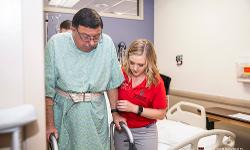 TTUHSC Physical Therapy student helping a patient