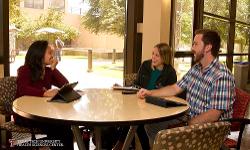 TTUHSC students around a table talking