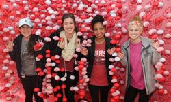 Students posing with the immersive brain display for the fifty celebration.