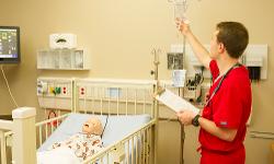 Nursing student with mannequin at the Simlife Center