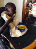 This is Caleb. After using spoons and bowls to practice feeding, Caleb had the opportunity to feed himself. Everyone was so impressed with him.