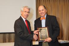 TTUHSC Neurology faculty receiving an award from Dr. Berk.
