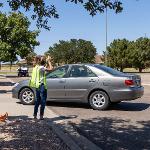 Crossing guard getting drivers attention
