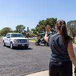 Volunteer asking cars to stop