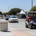 2 cars waiting following the golf lead