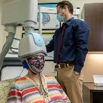 Dana Bear getting her Transcranial Magnetic stimulation treatment