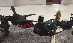 Two dinosaurs wearing masks