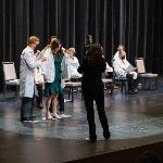 Students receiving their white coats