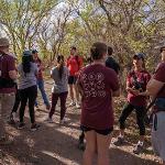 Brian Kendall, M.D. speaking to medical students hiking in Lubbock