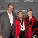 Chancellor Mitchell and President Rice-Spearman with awardee Courtney M. Queen, Ph.D.