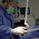 Dr. Alan Pang performs the laser treatment on Tonya Lambert's burn scars