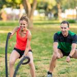 Woman smiling while exercising intensely.