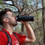 Emergency medicine student drinking water