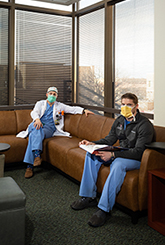 Image of two medical residents seated in a room