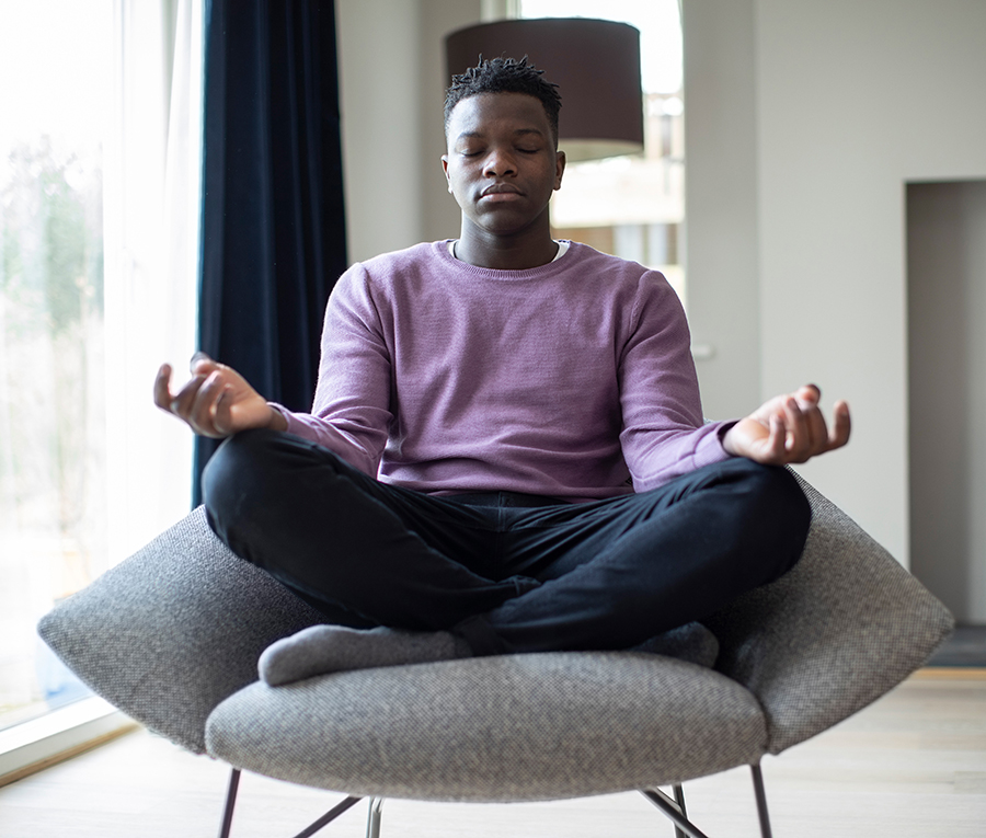 Mindful student relaxing in chair