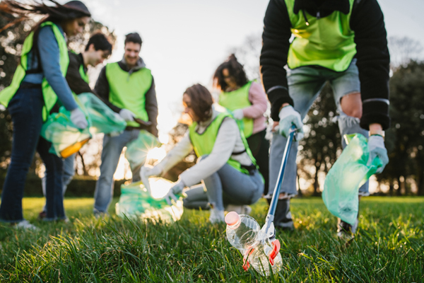 people picking up trashing, cleaning