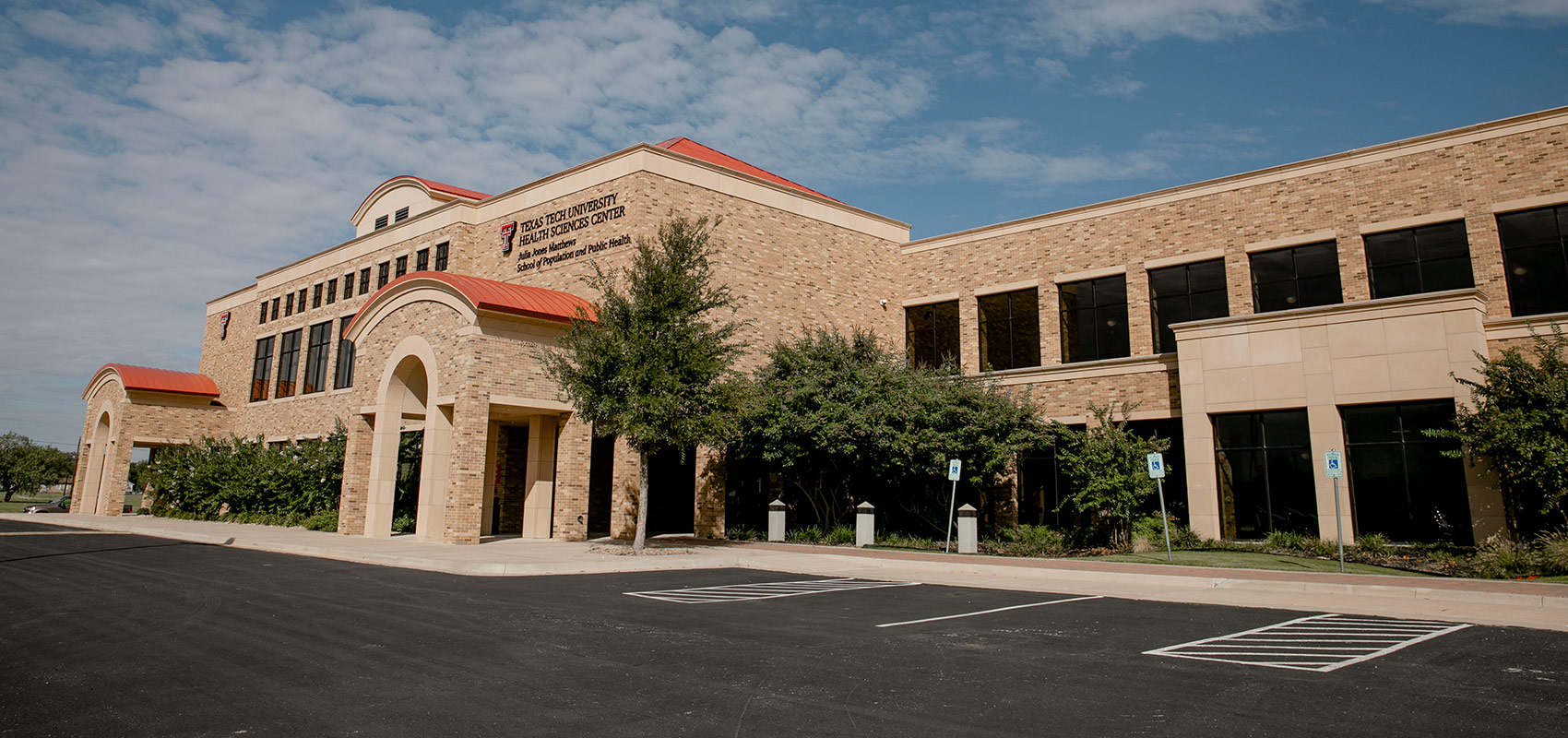 Front of building of Abilene TTUHSC School of Population and Public Health and some of the parking lot.