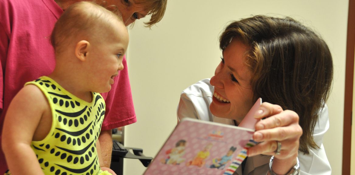 Pediatric doctor with child and mother