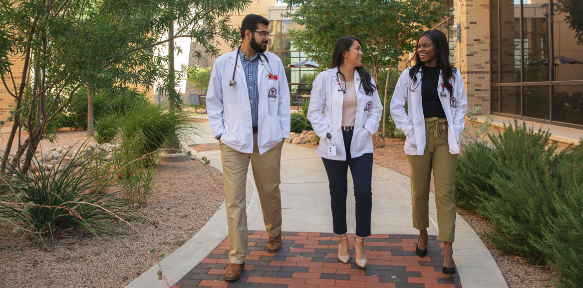 TTUHSC Medical Students walking through the courtyard.