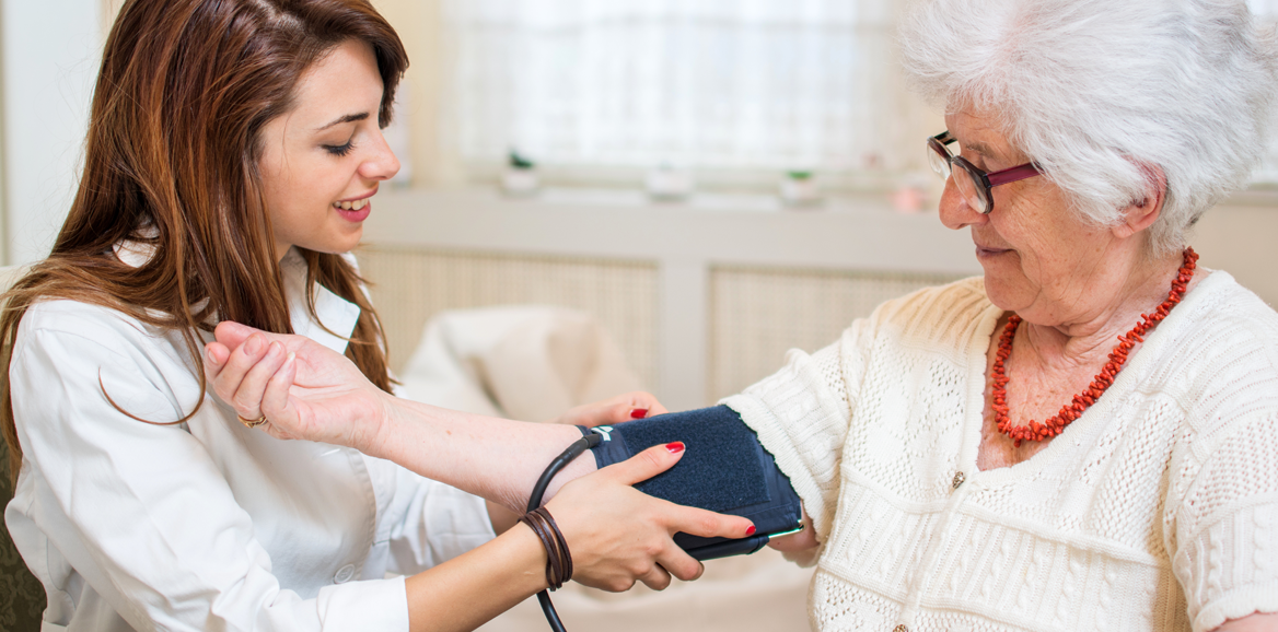 Nursing taking the blood pressure of a patient