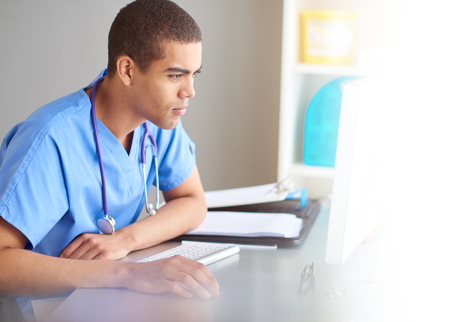 male nurse at computer