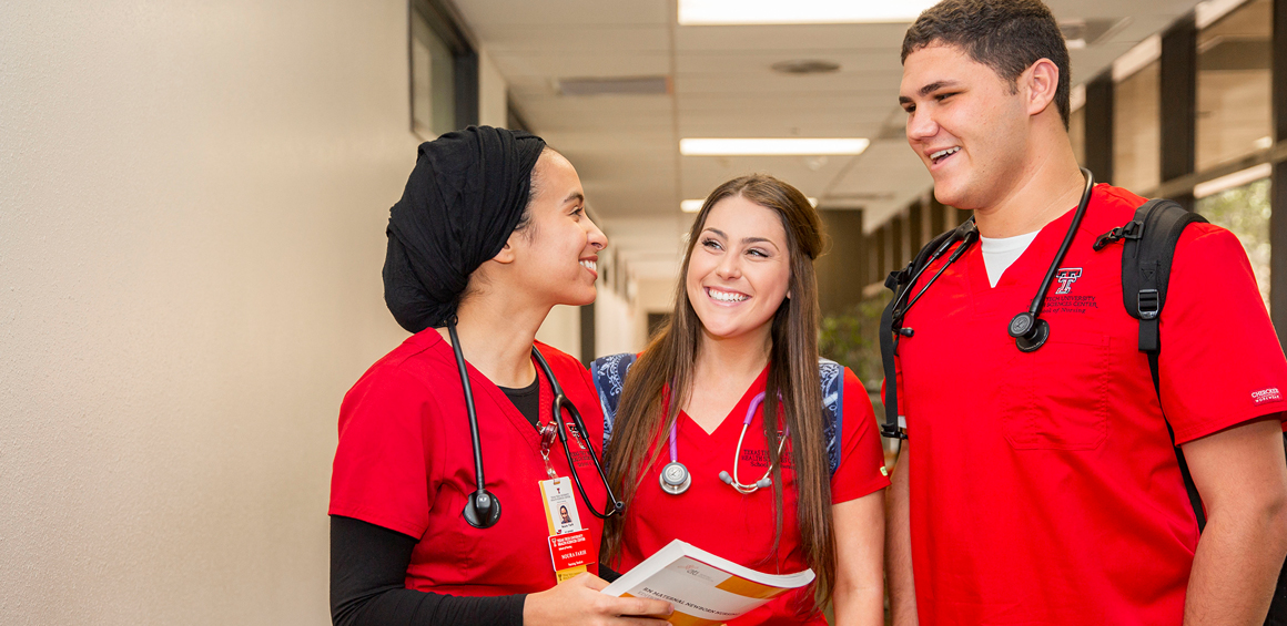 TTUHSC nursing students visiting in a hallway.