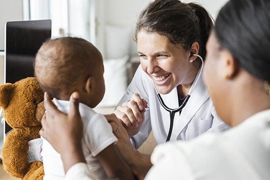 nurse practitioner with mother and baby