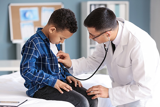 nurse practitioner with young boy and stethoscope3