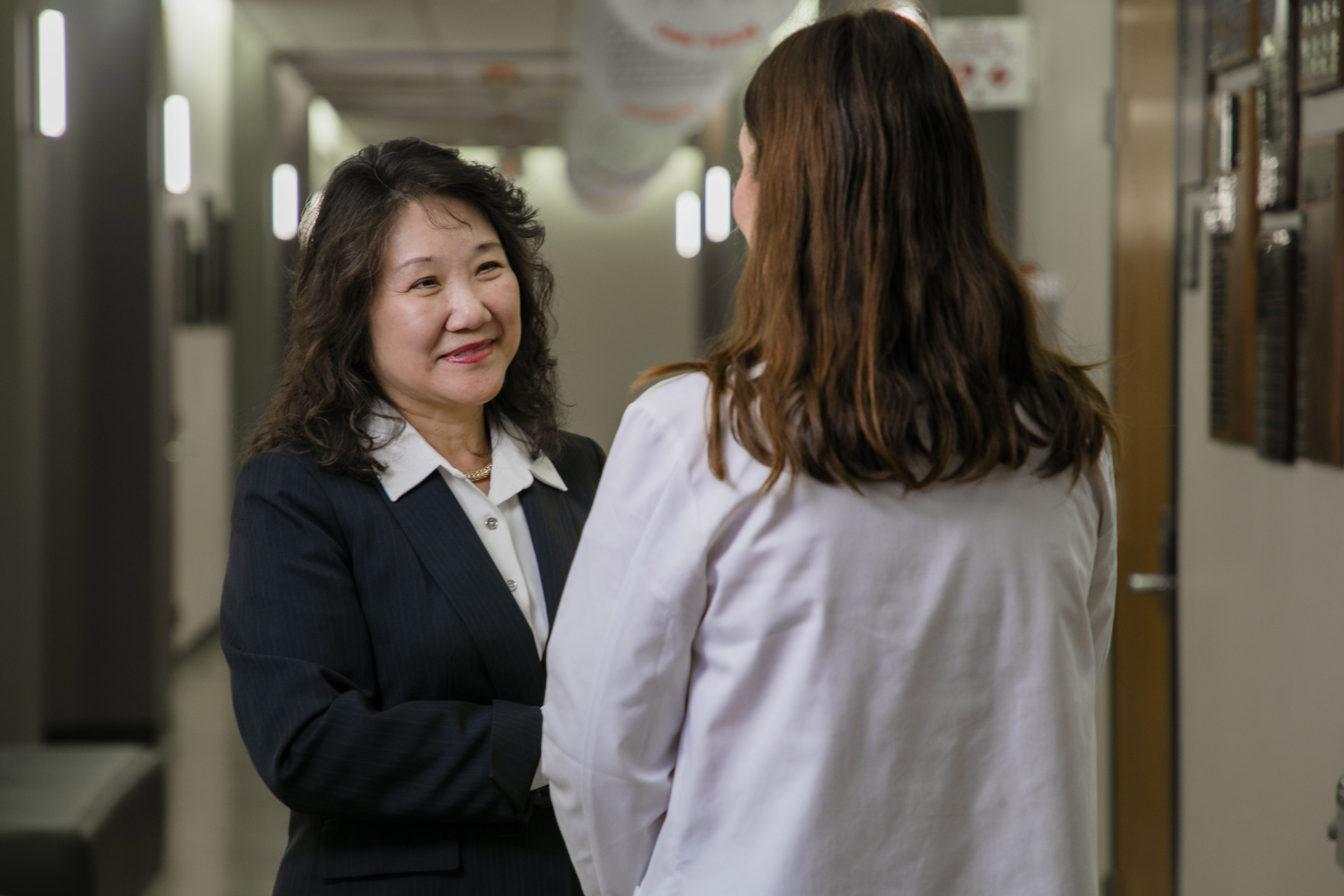 Dean Kou talking to SOP student