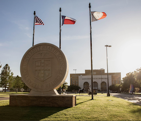 campus image with logo statue