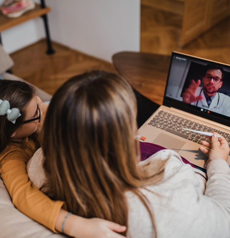 Mother and daughter on a telehealth visit