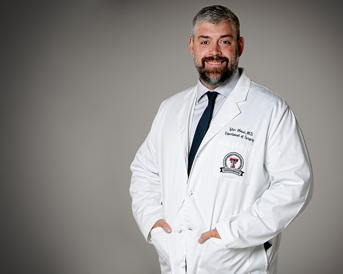 Dr. Hutson facing camera