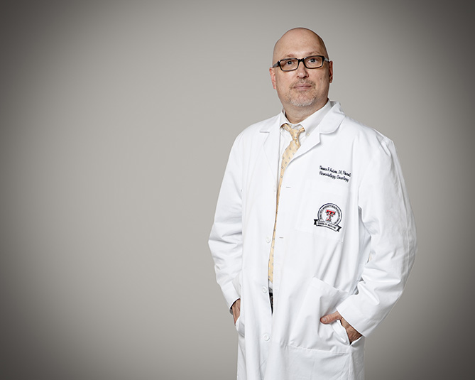 Dr. Hutson facing camera