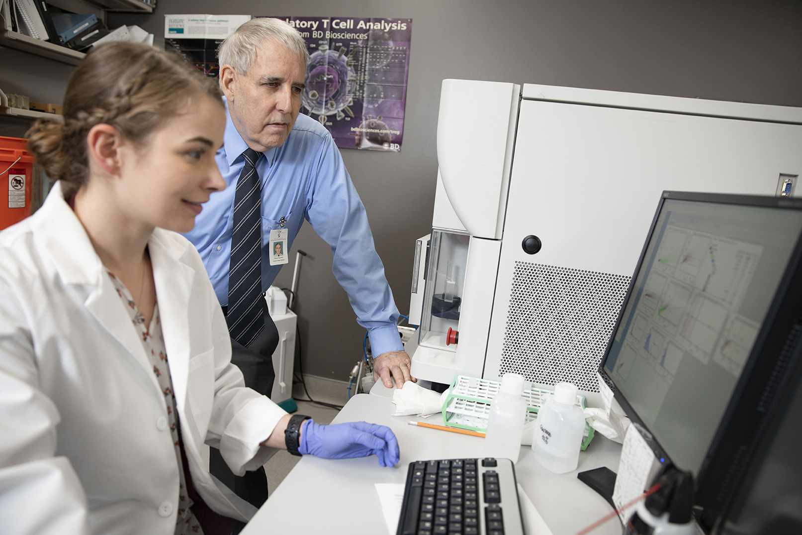 Research activity Dr. Reynolds and researcher view data