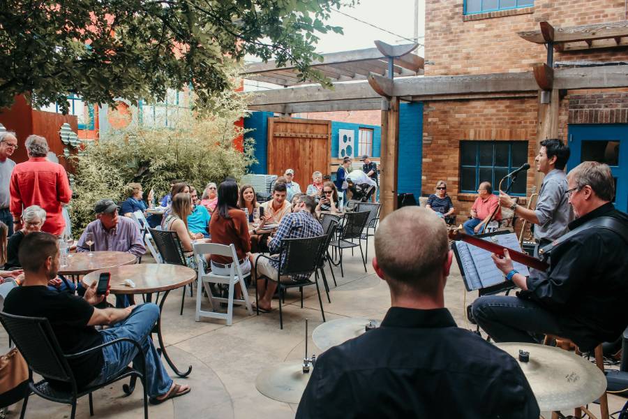 picture of a people on the patio at McPherson Cellars listening to live music