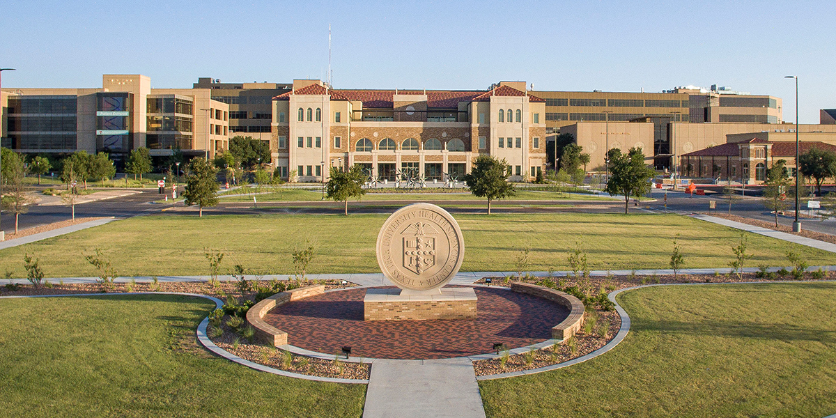 picture of the Texas Tech University Health Sciences Center seal in front of the university center