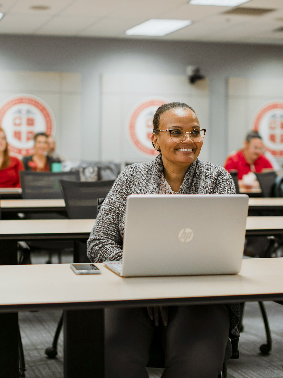 TTUHSC Lubbock Doctor of Nurse Practitioner students sitting in a classroom with laptops on the table