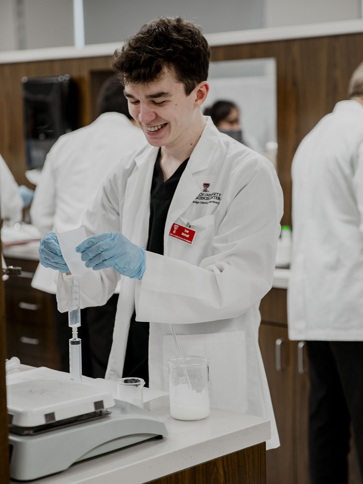TTUHSC Dallas Mansfield photo of pharmacy student mixing contents in a syringe